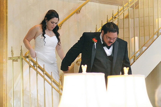 bride & groom down the staircase