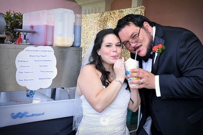 bride and groom eat snoballs